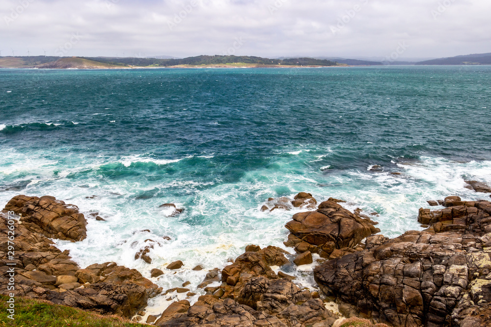 Muxia or Mugia rocky coastal view with rough sea on the Way of St. James, Camino de Santiago, Province of A Coruna, Galicia, Spain