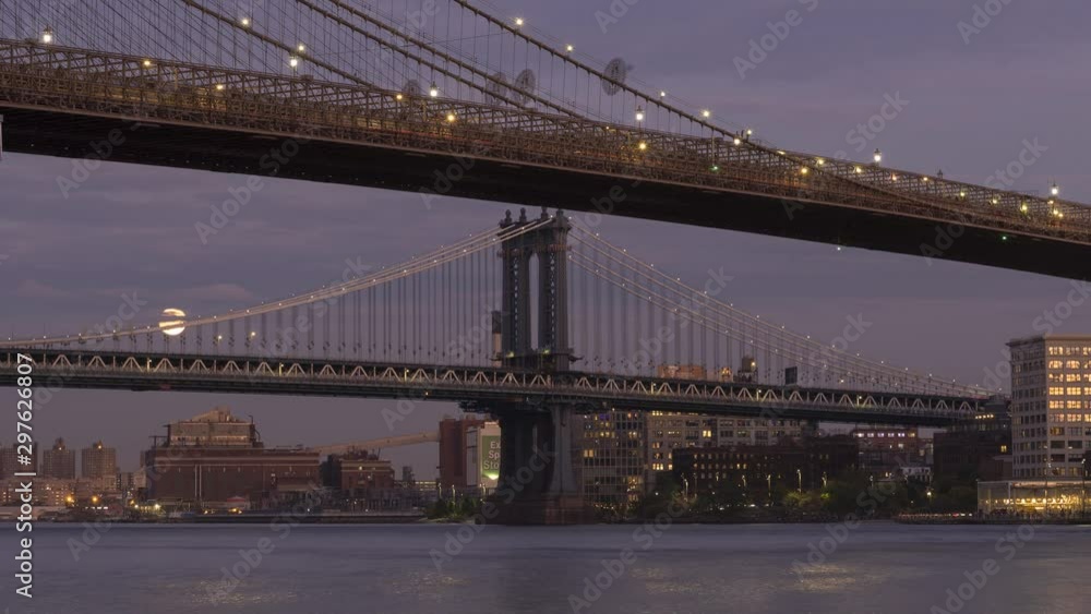 Moon rise time-lapse form East river with Manhattan And Brooklyn bridge day to night . Moon rise time-lapse form East river with Manhattan And Brooklyn bridge day to night .