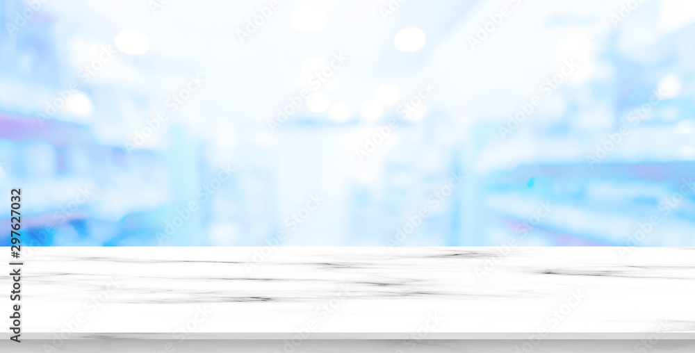 abstract blurred drug store aisle shelf distribution background with white wood perspective counter to show,promote ans advertise products on display for medical pharmaceutical business concept