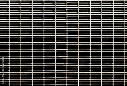 Detail of a metal grate for water runoff. Useful for textures and patterns.