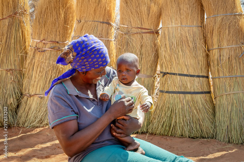 African woman carry child