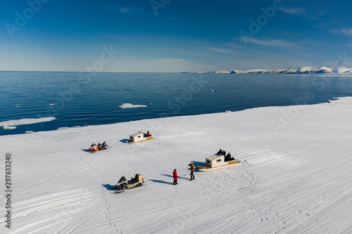 Aerial drone photo of tourists visit the floe edge near Sirmilik National Park in Nunavut, Canadaa photo