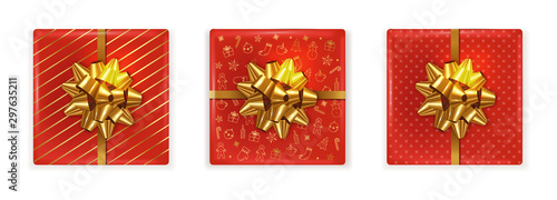 Top view of christmas red gift boxes with golden ribbon. Decorations on the b...