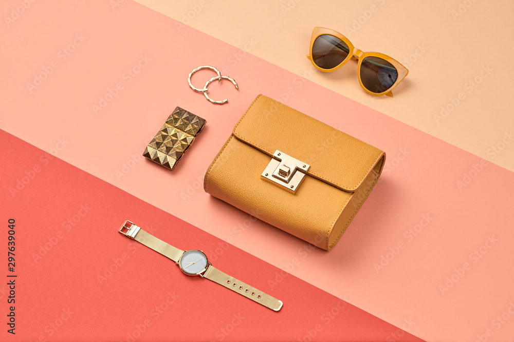 © evgenij918 - Fashion Lady layout. Woman Essentials Set. Collection beauty accessories. Trendy Clutch, Brushes, lipstick. Coloful fashionable orange coral art Flat lay. Creative artist concept © evgenij918 - Fashion Lady layout. Woman Essentials Set. Collection beauty accessories. Trendy Clutch, Brushes, lipstick. Coloful fashionable orange coral art Flat lay. Creative artist concept