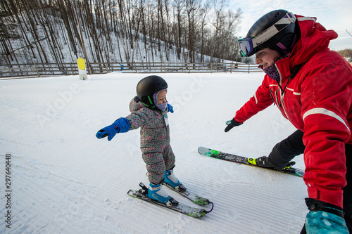 Young girl takes a skiing lesson