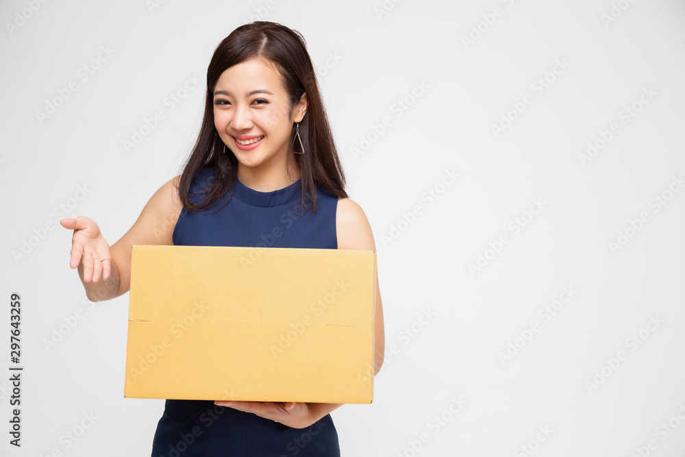 Happy Asian woman holding package parcel box, Delivery courier and shipment service concept Happy Asian woman holding package parcel box, Delivery courier and shipment service concept