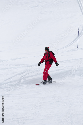 Snowboarder on snowy ski slope