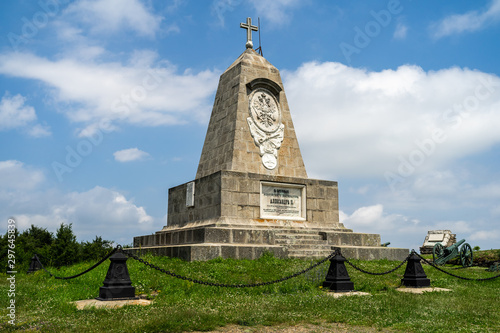 Monument of the Russian emperor Alexander II on Shipka Peak in Bulgaria. The text in Cyrillic: In honor of the reign of Emperor Alexander II. photo