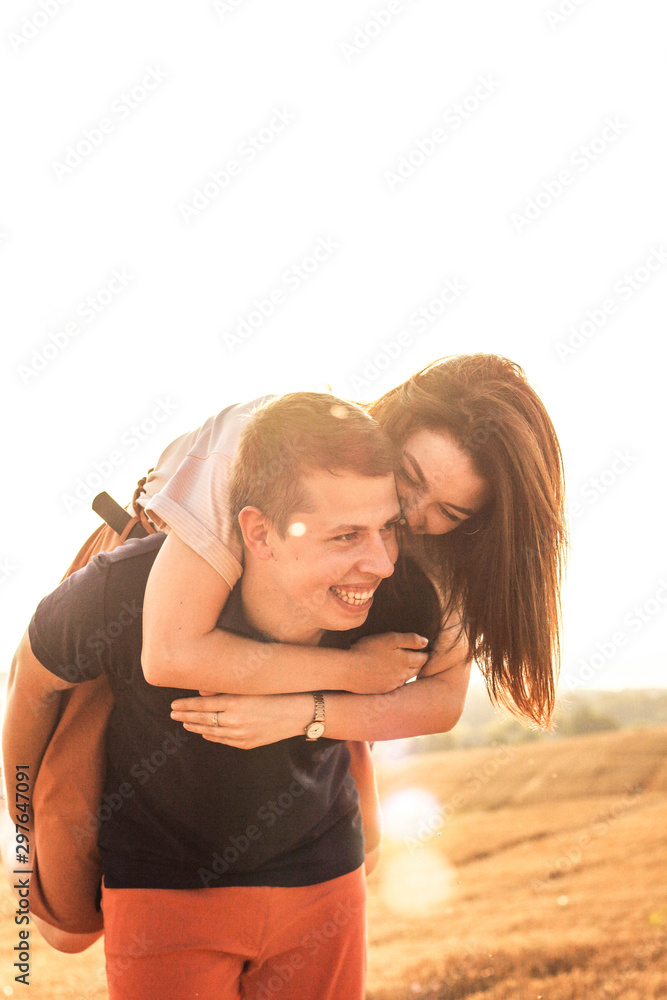 Fototapeta premium married couple walking in the field