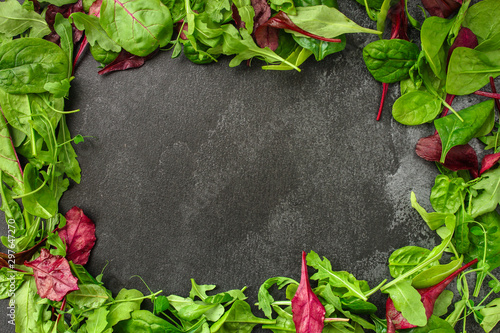 Healthy salad, leaves mix salad (mix micro greens, juicy snack, tomato). food background - Image. copy space. Top view