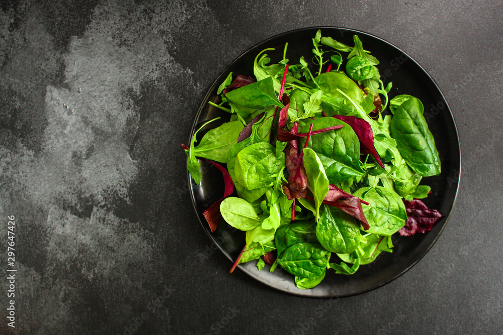 Healthy salad, leaves mix salad (mix micro greens, juicy snack, tomato). food background - Image. copy space. Top view