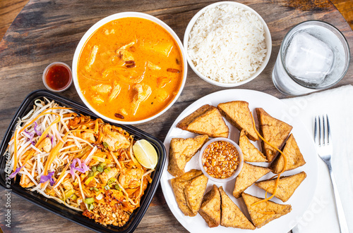 Delicious Thai food variety of food with curry, pad thai, tofu and rice
