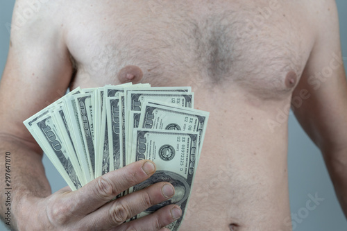 naked caucasian man with bills in his hand on White background