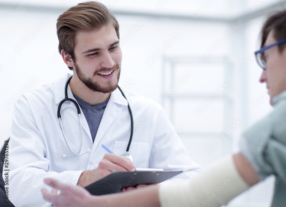doctor writing a prescription to her patient, doctor writing a prescription to her patient,