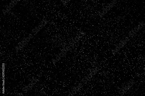 Seamless background to create a starry sky. Outer space with stars, black and white version.