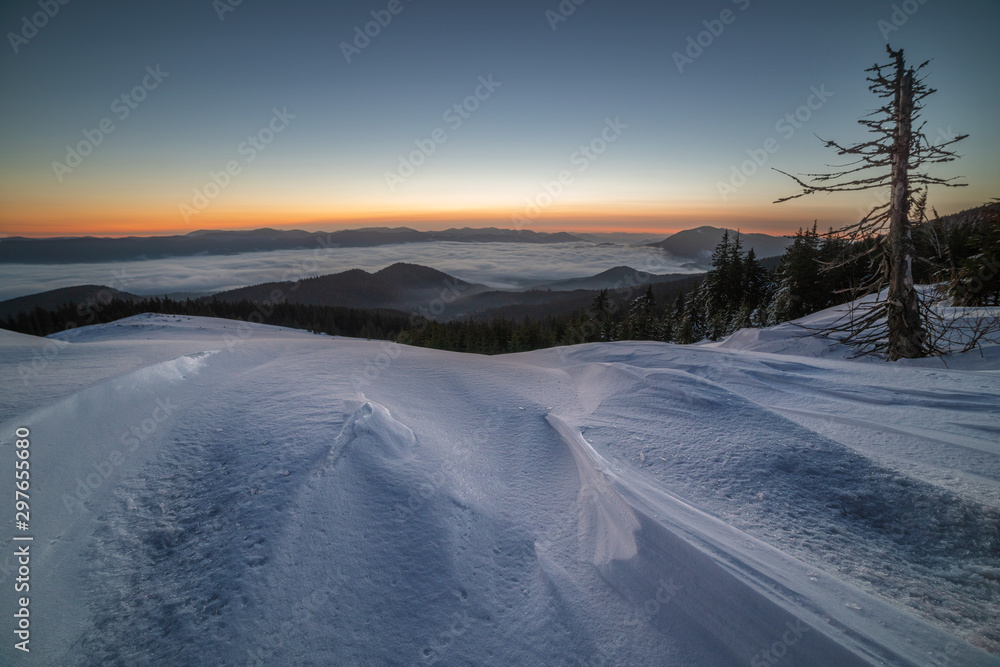 Beautiful winter landscapes from the Ukrainian Carpathian Mountains with traumatic skies and tourists, traveling on ridges Beautiful winter landscapes from the Ukrainian Carpathian Mountains with traumatic skies and tourists, traveling on ridges
