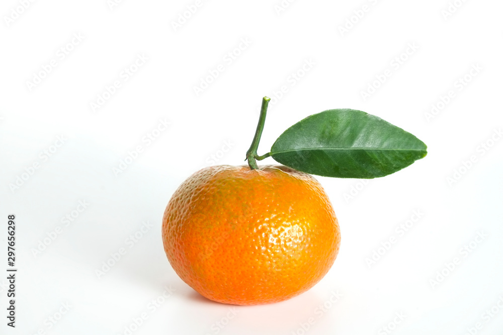 Close up image of one juicy organic whole tangerine with green leaves & visible zest texture, isolated white background, copy space. Macro shot of single bright citrus fruit. Top view, flat lay. Close up image of one juicy organic whole tangerine with green leaves & visible zest texture, isolated white background, copy space. Macro shot of single bright citrus fruit. Top view, flat lay.