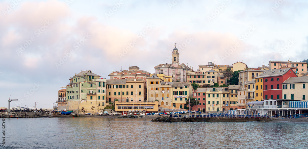 Colorful old houses in Bogliasco, beach and pier, Italy