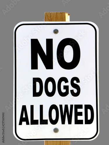 Sign reads: NO DOGS ALLOWED; isolated on grey