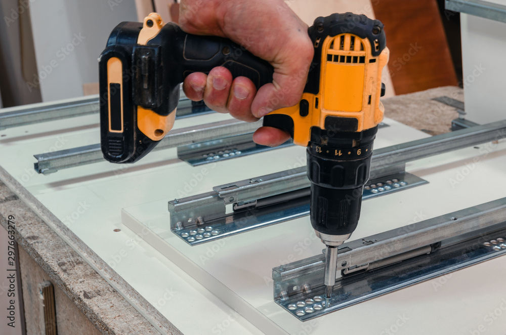 Assembly of hard furniture, close-up drawers for drawers