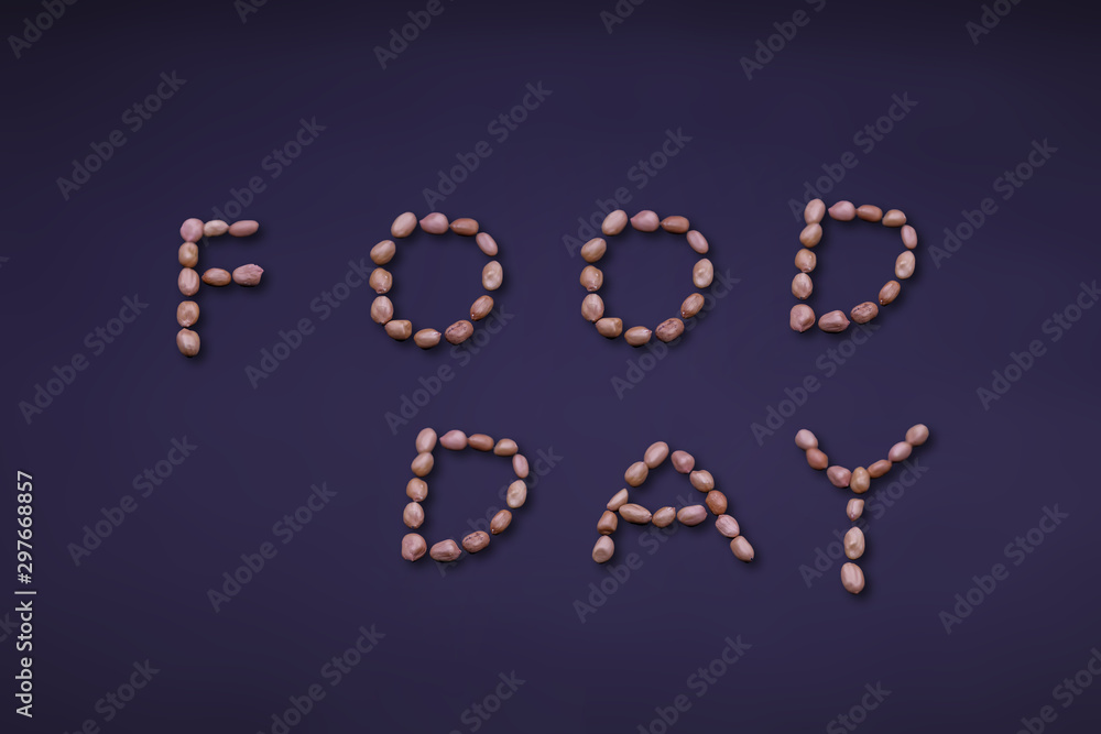 World food day concept: words of the peanuts on the black background. World food day concept: words of the peanuts on the black background.