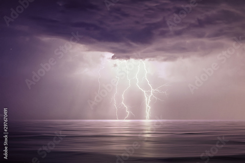 Starry night with Thunderstorm. Night thunderstorm with lightning above the sea