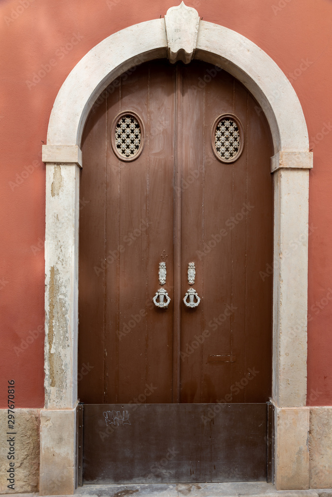 Old wooden door in Tavira, Algarve, Portugal.