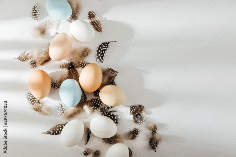 Natural Colored brown, quail and white Eggs with sunlights. Compositions in pastel colors. Easter consept. Flat lay, top view . Natural Colored brown, quail and white Eggs with sunlights. Compositions in pastel colors. Easter consept. Flat lay, top view .