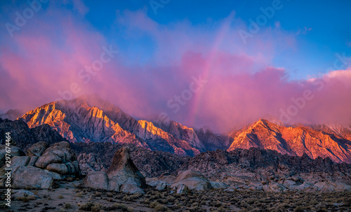 mountain sunrise with rainbow