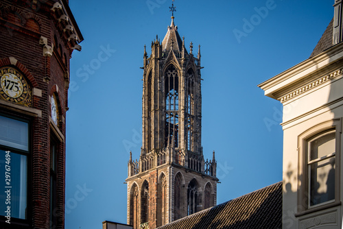 Fotografie Dom cathedral tower Utrecht up in the air high with a clear blue sky