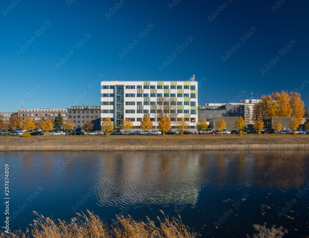 Fototapeta premium Modern architecture. Office building. Reflection on the water.