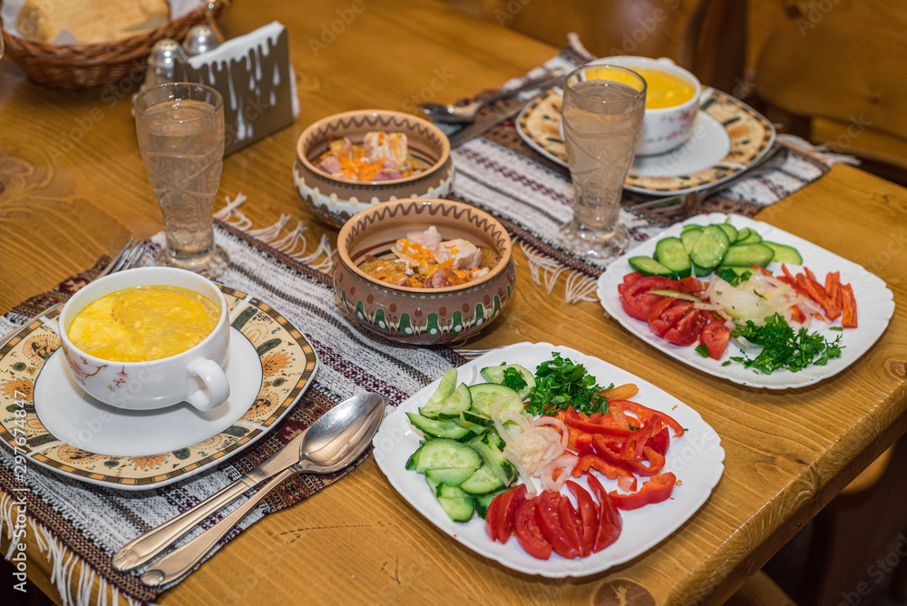 Lunch in the Ukrainian style from banosh, baked meat and vegetables