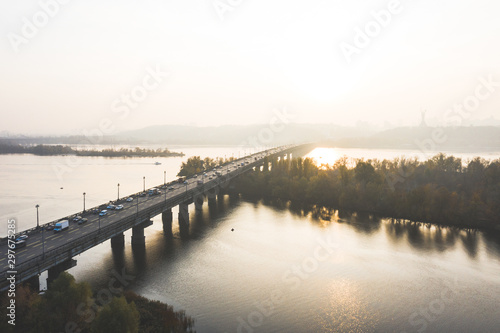 Aerial photo Smog over the Dnipro River in Kyiv  Ukraine. Autumn smoke pollution over the city. Paton bridge in foggy haze from city smog. Air pollution on the Dnipro in Kyiv.