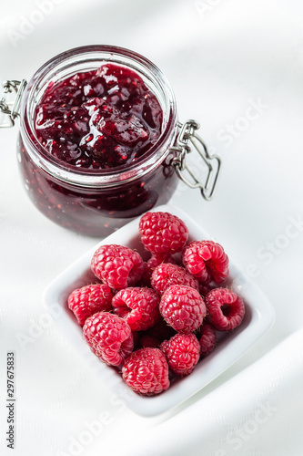 Sweet raspberry jam and raspberries.