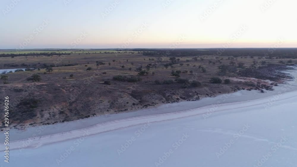 Aerial flight around salt lake and desert at sunrise Aerial flight around salt lake and desert at sunrise
