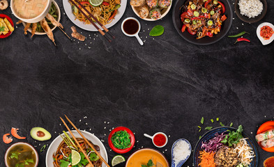 Asian food background with various ingredients on rustic stone background , top view. Vietnam or Thai cuisine.