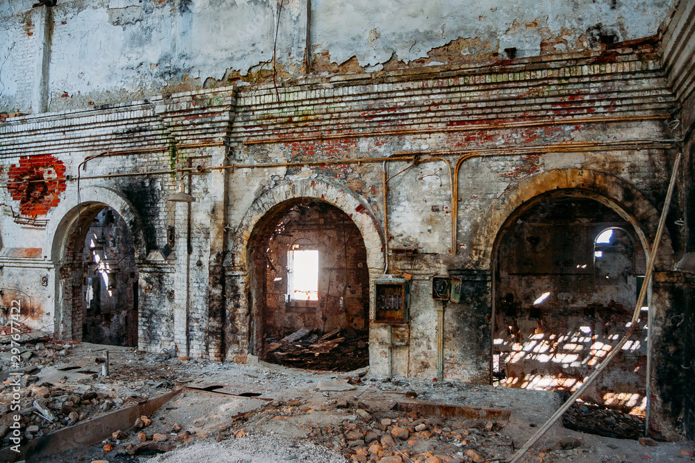 Fototapeta premium Interior of old abandoned red brick industrial building