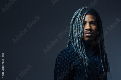 Valokuva Portrait of a  serious young man with cool hair  and cool black and gray hair in