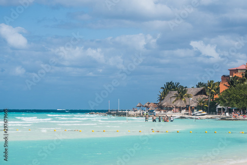 Tourists enjoying vacation at Caribbean sea in Cancun, Mexico