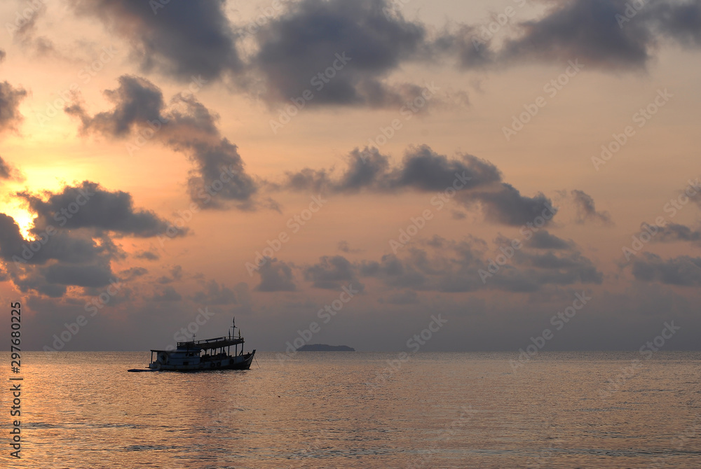 The sea in the morning with anchored fishing boats