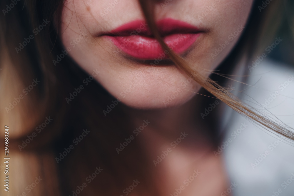 Close up portrait of part of caucasian woman face.  Thin woman lips with red lipstick on it. Concept of fashion and face. - obrazy, fototapety, plakaty 