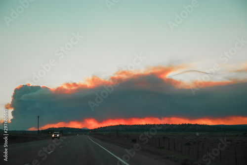 Road Trip during wildfires on the horizon in Arizona. Climate change, wildfires, dramatic views.