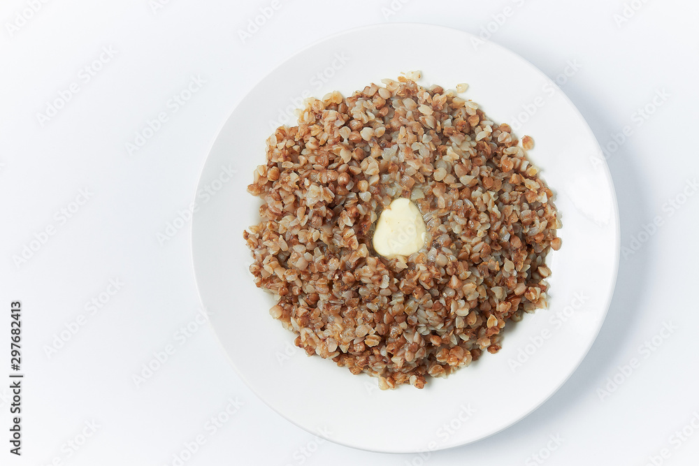 buckwheat in a white plate on a white background buckwheat in a white plate on a white background