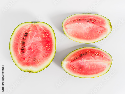 Halved watermelon on white background.