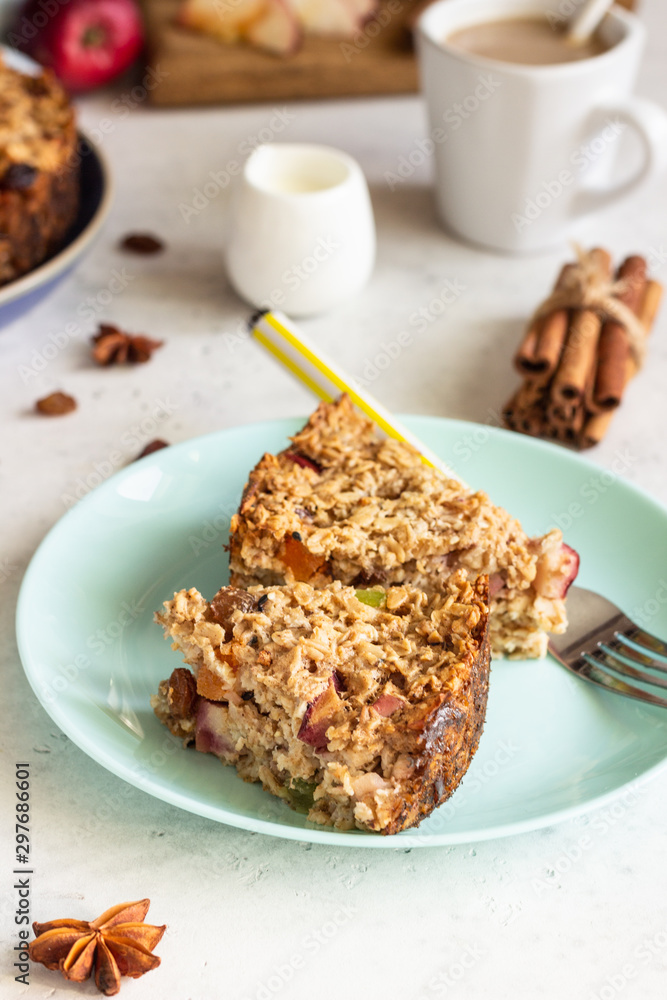 Oatmeal cake or baked oatmeal with apples and raisin. Dietary autumn pastries, healthy breakfast. Oatmeal cake or baked oatmeal with apples and raisin. Dietary autumn pastries, healthy breakfast.
