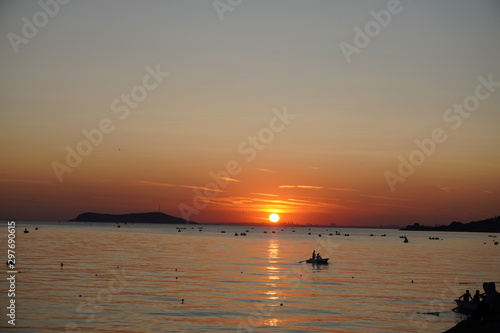 fishing boat, boats and people on Sunset Beach