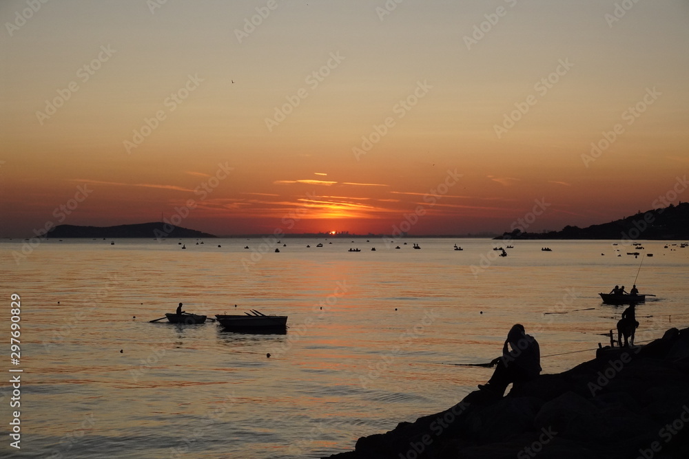 fishing boat, boats and people on Sunset Beach