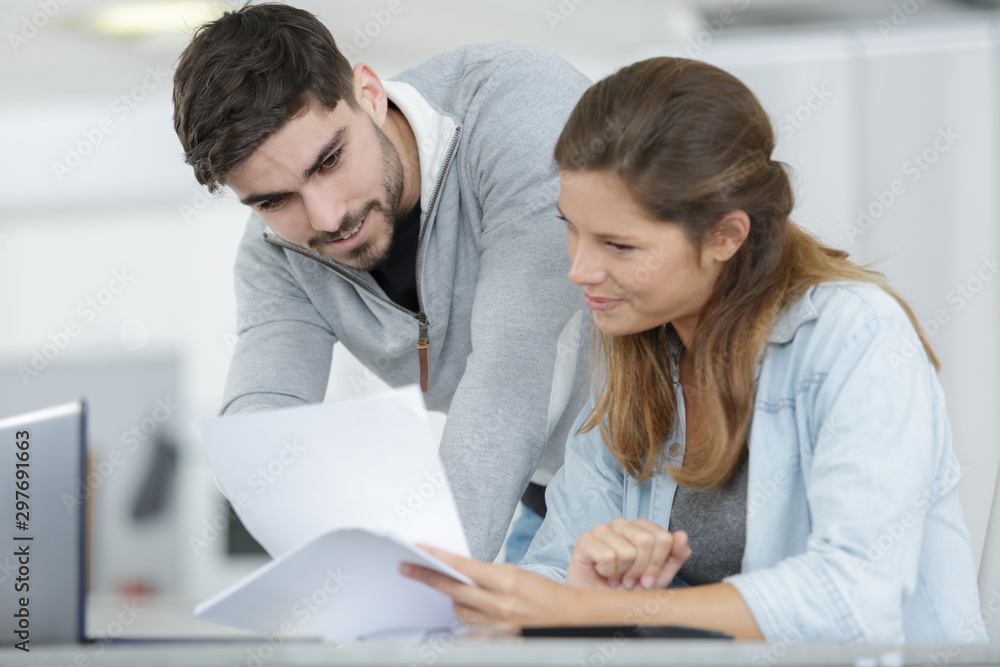 concentrated young man and woman working at home concentrated young man and woman working at home