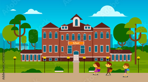 Happy kids are going to school with schoolbag. Beautiful building with green yard in front of the school building.