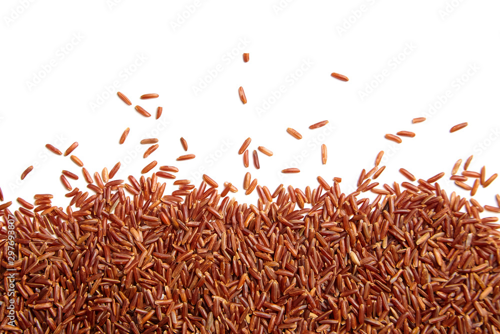 Red rice scattered on white background. Heap of uncooked dry rice grains, top view - obrazy, fototapety, plakaty 